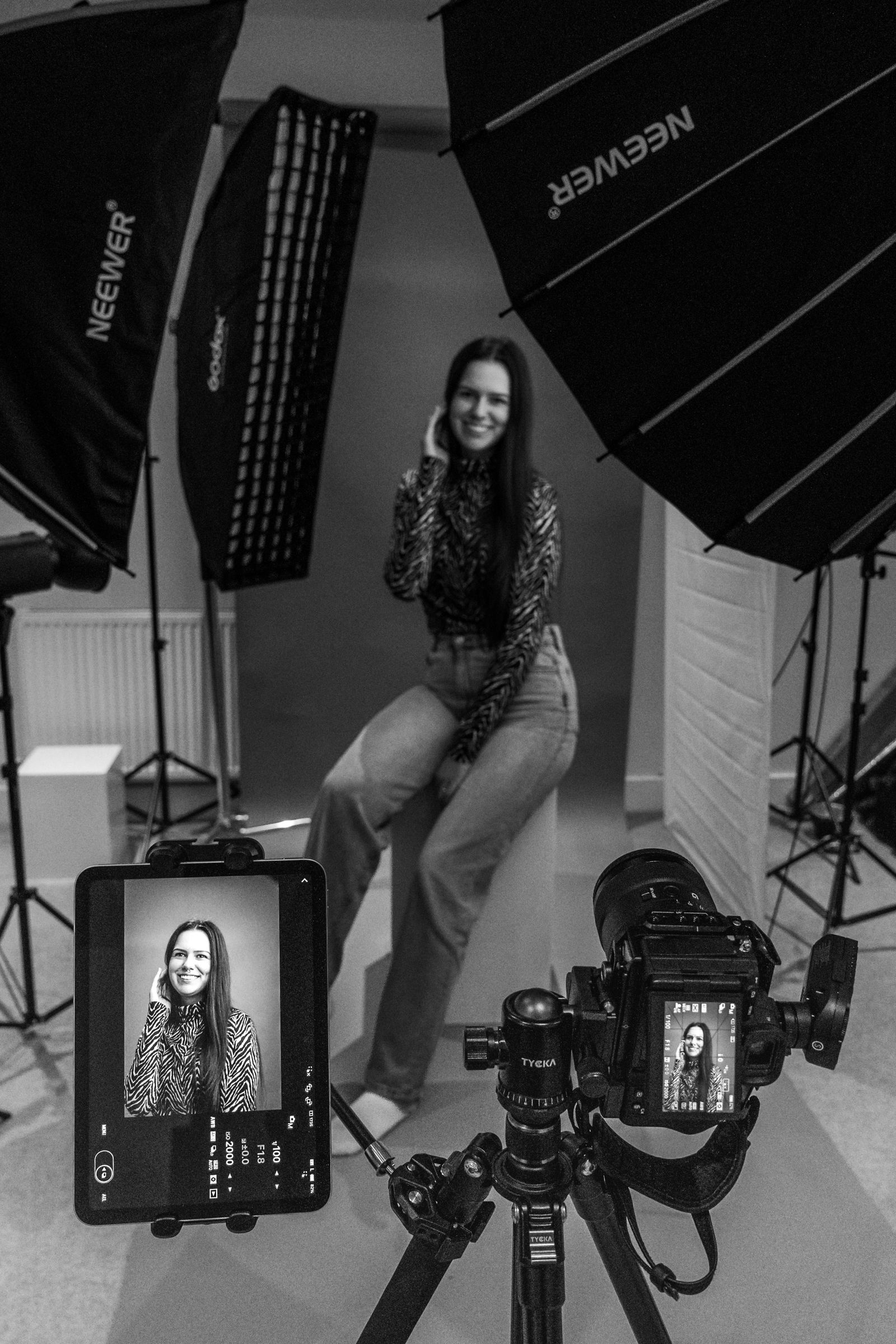 Behind the scenes of a portrait session with monitor playback