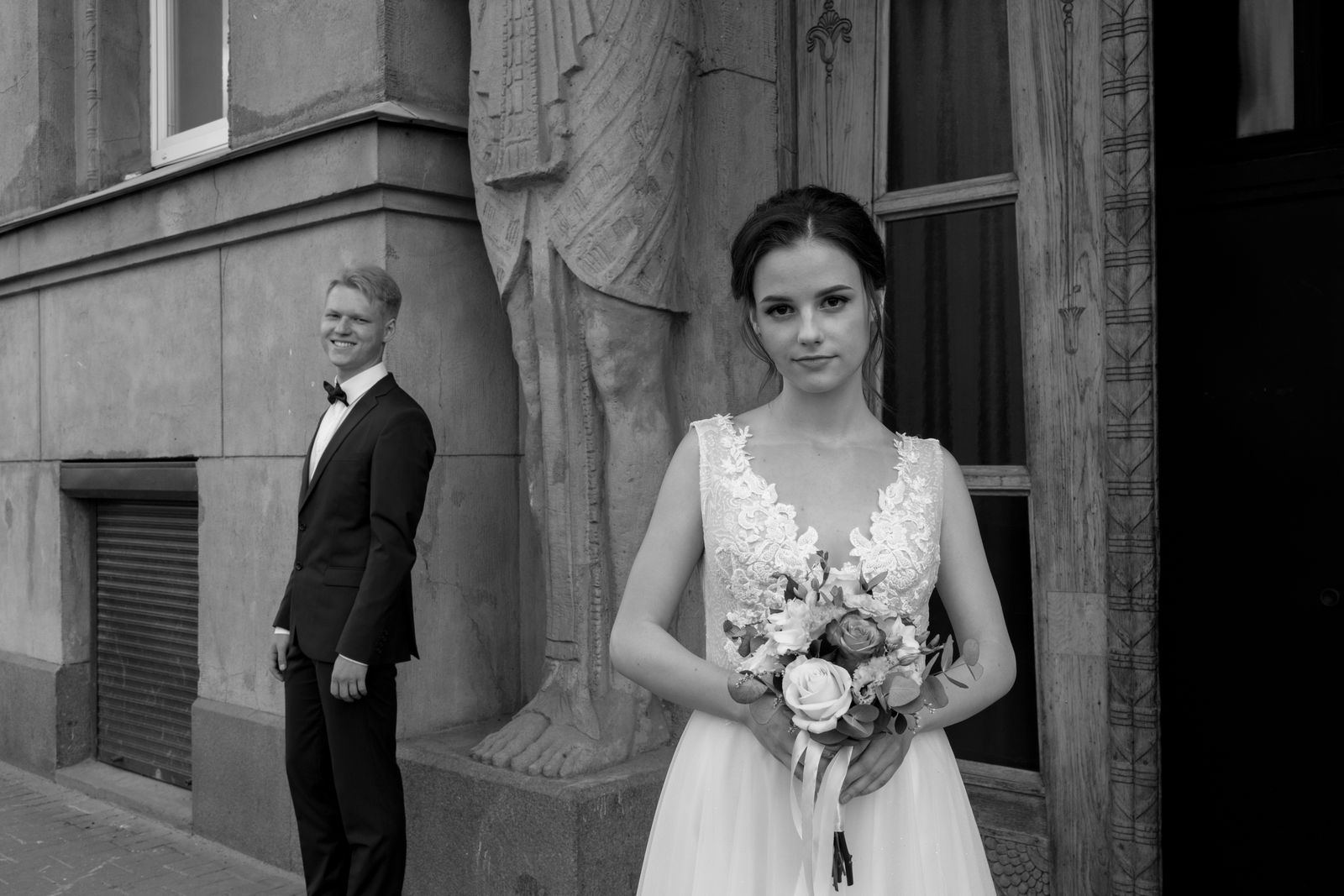 Black and white editorial portrait of a bride and groom