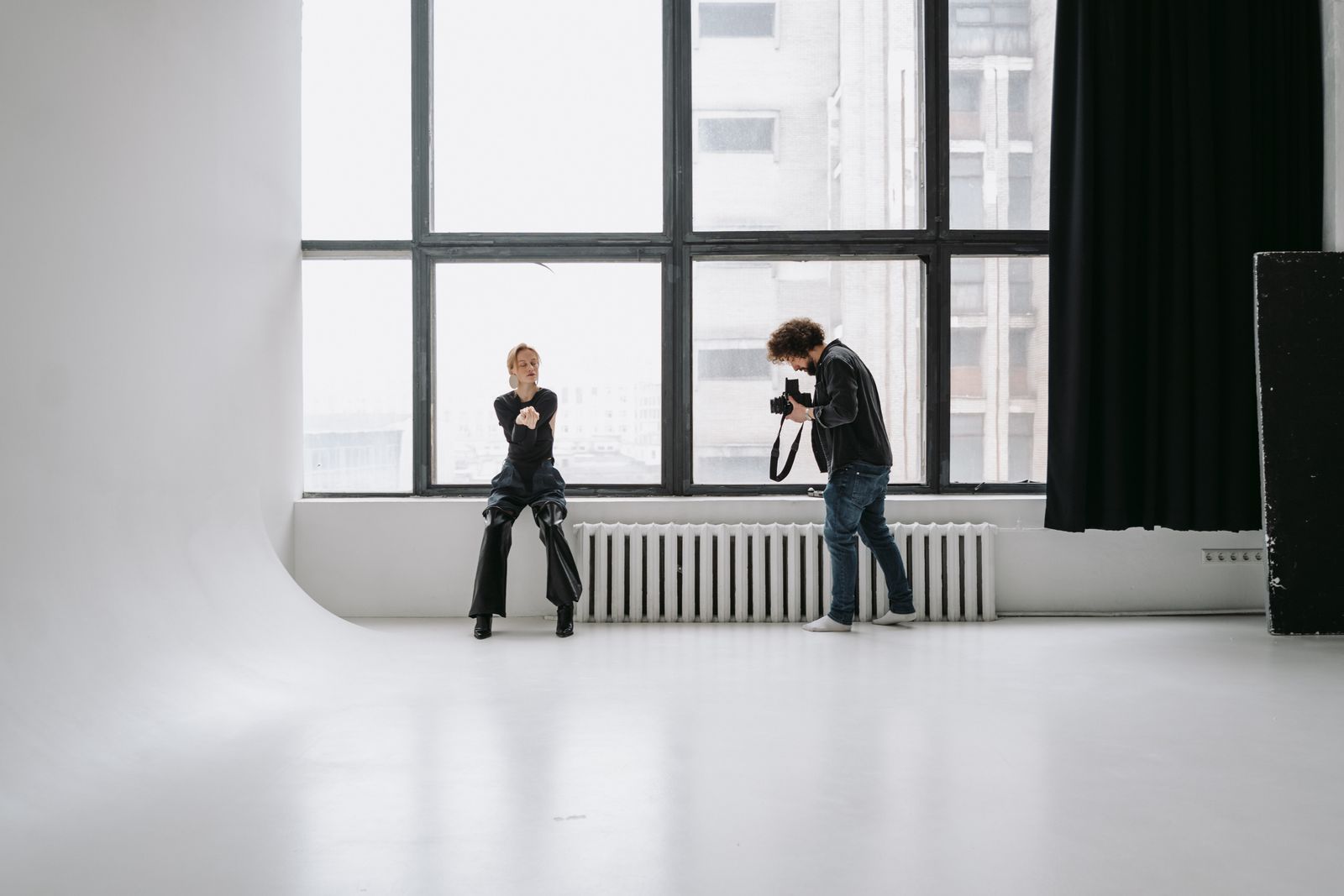 A photographer working with natural window light in the Solarium